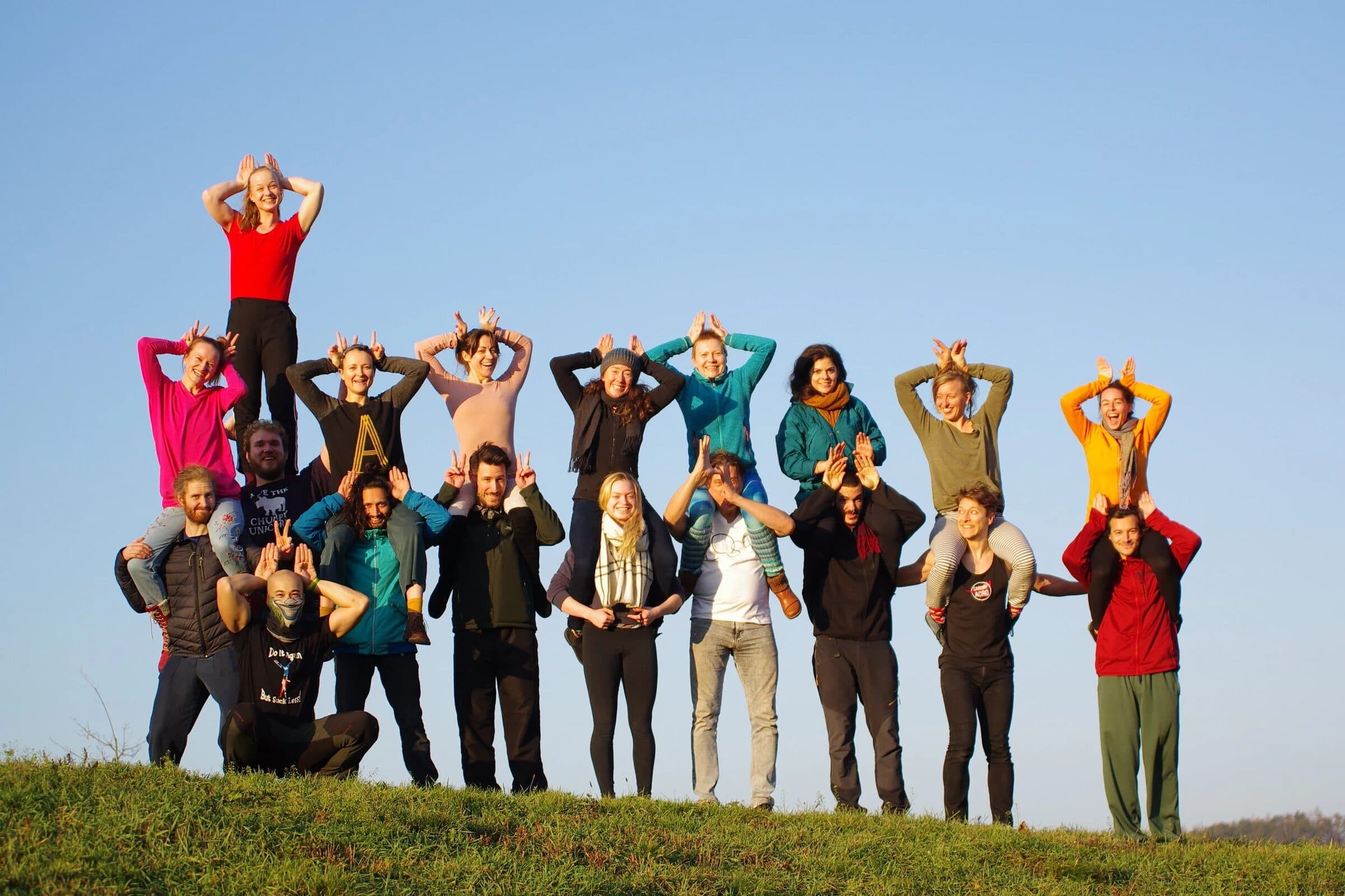 The LEAP group on a hilltop, some flyers standing on their bases' shoulders